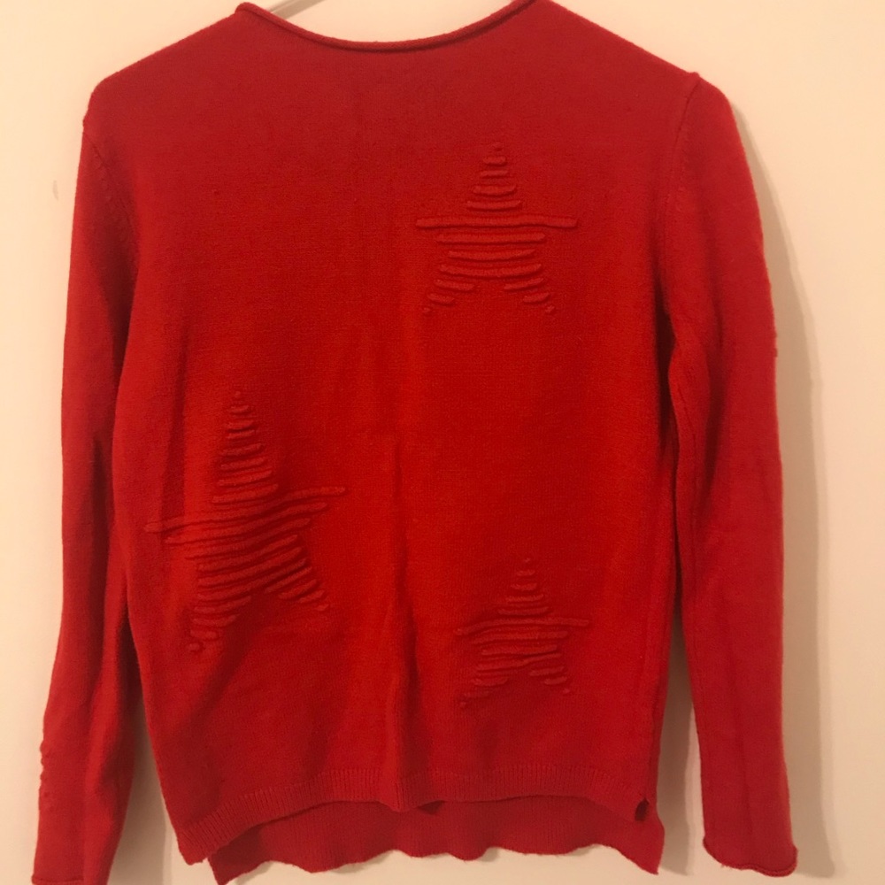 Red sweater with star patterns (on front)